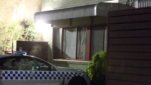 Police outside the Fitzroy apartment block on Cecil Street where the man was found dead.