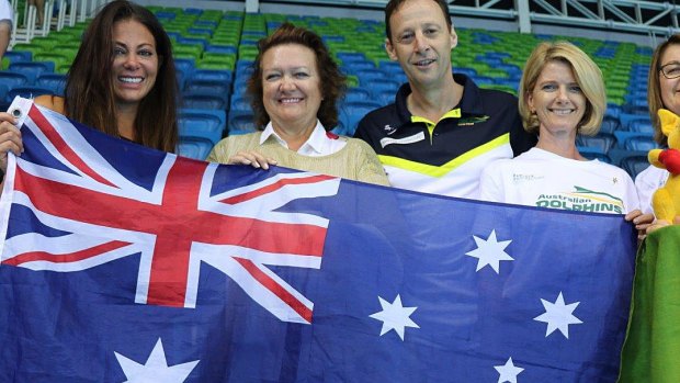 Gina Rinehart and others holding up an Australian flag at the Rio olympics in Brazil