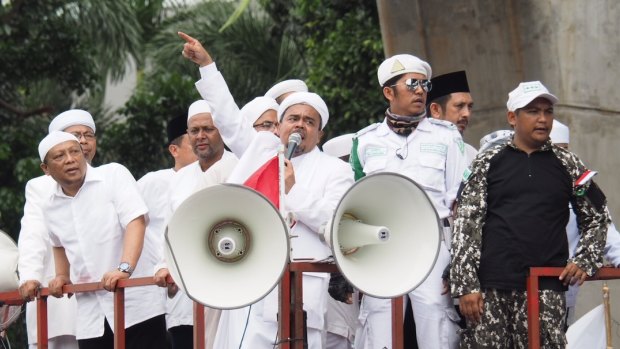 Islam Defenders' Front protesters led by Muhammad Rizieq Shihab (pointing) demand the sacking of police officials over treatment of their activists in Jakarta in January.