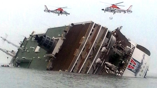 Rescue helicopters fly over the ferry Sewol after it foundered in April 2014.