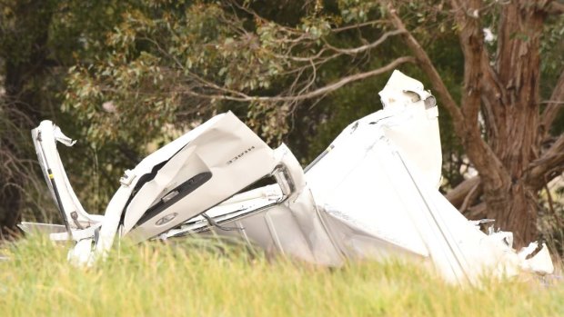 A woman died after a car crashed while being chased by police near on the Western Freeway.