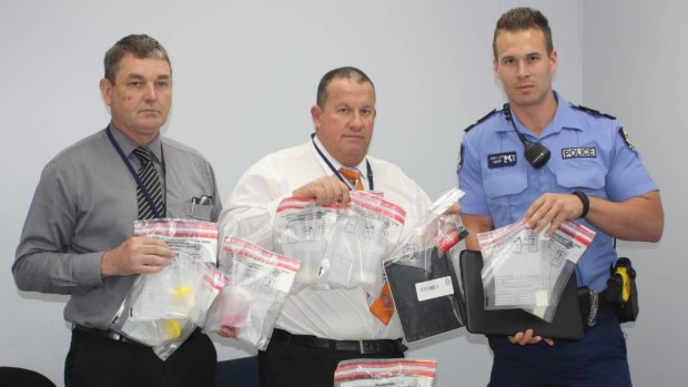 Detective Constable Mike Williams, Detective Senior Sergeant Mitch Howard and Constable Jeremy Lloyd with the drugs seized. 