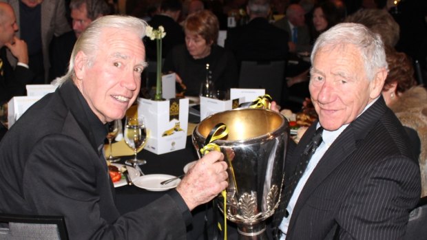 Billy Barrot with Tommy and the 1980 premiership cup in 2014.