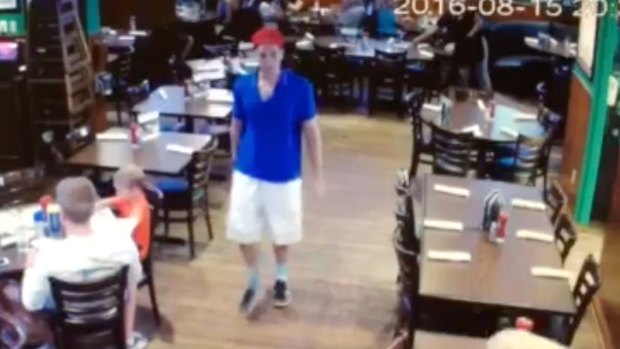 This image made from a video released by a Florida restaurant shows Austin Harrouff.