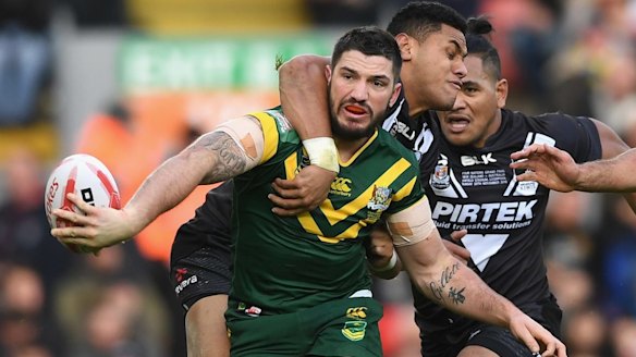 Matt Gillett tries to offload as he's tackled by New Zealand's David Fusitu'a in the Four Nations final at Anfield on Sunday.
