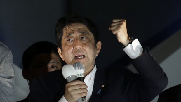 Shinzo Abe, Japan's prime minister and president of the Liberal Democratic Party, centre, gestures as he speaks during a campaign event in Tokyo, Japan.