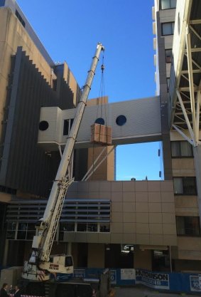Three cutting-edge imaging scanners have been craned into place during a delicate operation at the Royal Brisbane and Women’s Hospital.