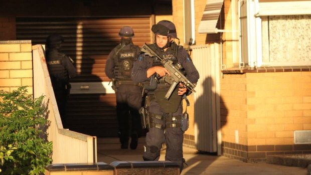 Police outside the house where Ora Holt and her husband died.