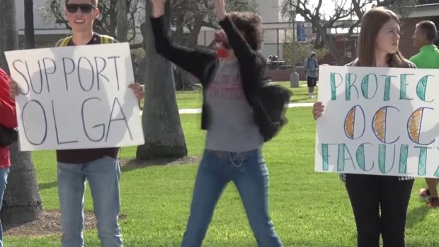 Students from Orange Coast College in Costa Mesa California hold a rally in support of human sexuality teacher Olga Cox earlier in December.