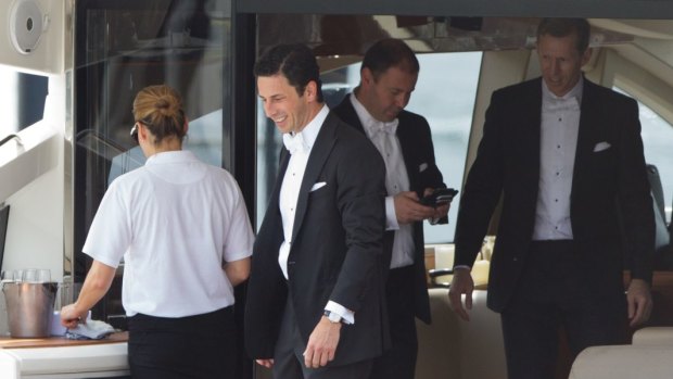 Ryan Stokes and his groomsmen board a boat for his wedding on Garden Island.