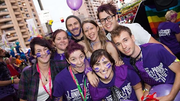 Students, police and the public celebrate Wear it Purple day in Sydney on Friday. 