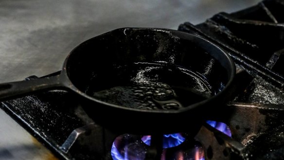 Preheat a heavy-based pan (Cooke uses cast iron) and add a thin layer of olive oil. Heat the pan until it's very hot but not smoking.