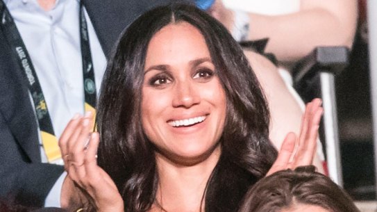 Meghan Markle sat with her friend Markus Anderson.