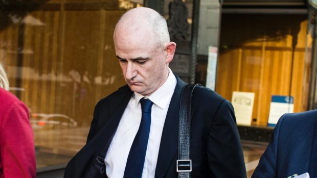 Cleared: Former Credit Suisse vice-president Darren Thompson leaving the Downing Centre Local Court on Monday.