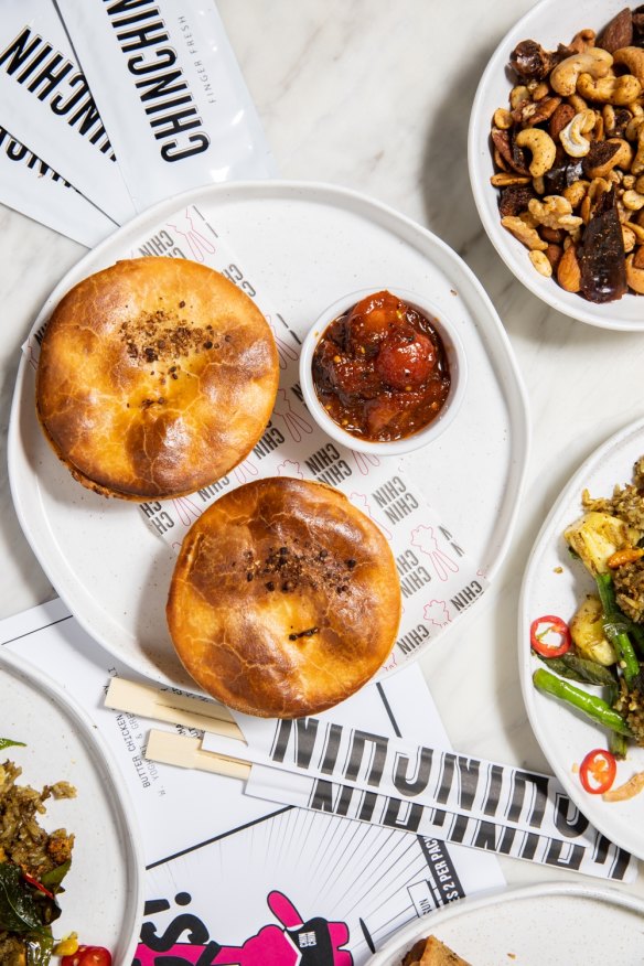 Chin Chin's grand final party pack featuring butter chicken pies, spring rolls and crab rice.