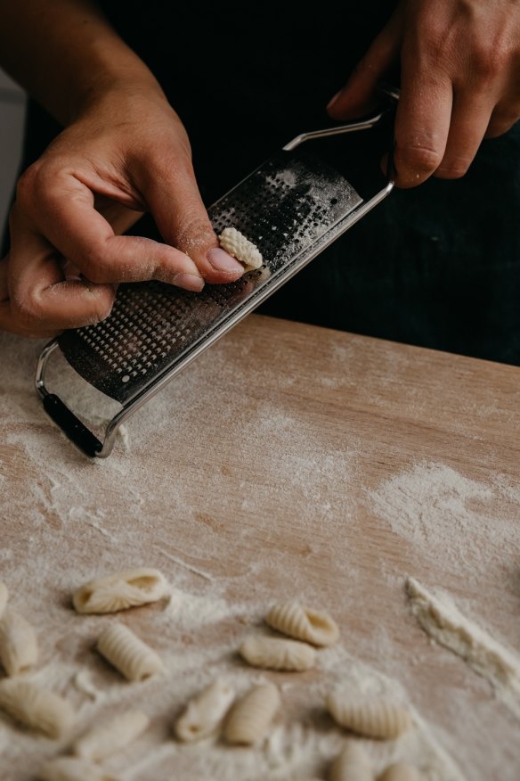 No fancy equipment necessary: you can use a Microplane grater, pictured, or even the ridges on a crusty loaf of bread to add texture to your pasta shapes.
