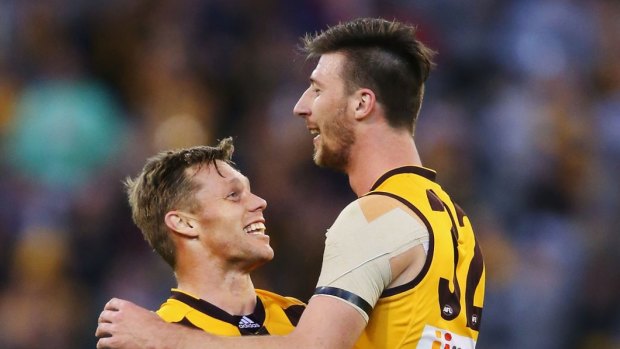 Sam Mitchell and Jack Fitzpatrick celebrate the win over Collingwood.