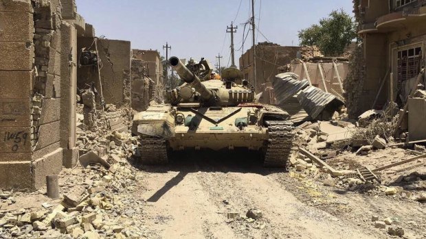 Iraqi security forces in al-Julan neighbourhood of Fallujah after defeating Islamic State militants on Sunday. 