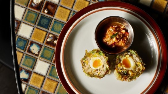 Firebird's scotch egg with salted duck egg relish and rice flakes.