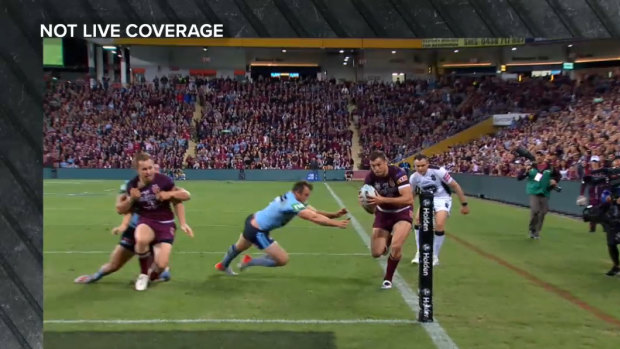 Fine line: Corey Oates' foot was shown to have caught the line, denying Queensland a try by the smallest margin. 