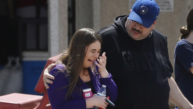 People arrive at MacArthur Elementary looking for family and friends. The school was being used as a reunification centre in the aftermath of the shooting.