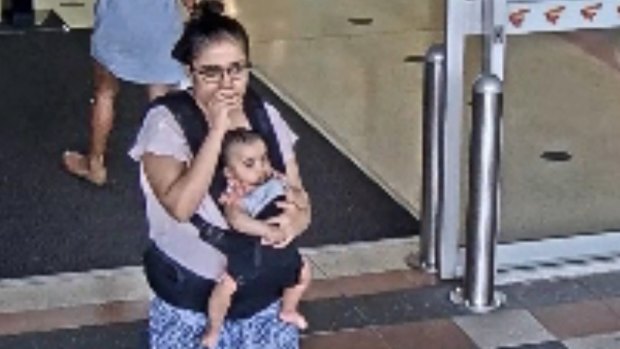 Security camera footage showing the mother with their baby girl at Buranda Village shopping centre on November 15.
