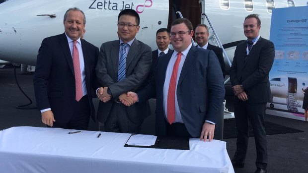 Geoffery Cassidy, front right, pictured at a signing ceremony in Orlando, Florida in 2016 to mark Zetta Jet adding four Bombardier Challenger 650 aircraft to its fleet.
