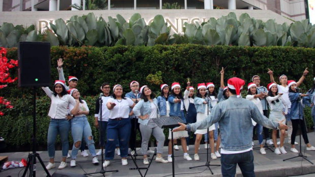 University choirs help stage the first official Christmas carols in Jakarta.