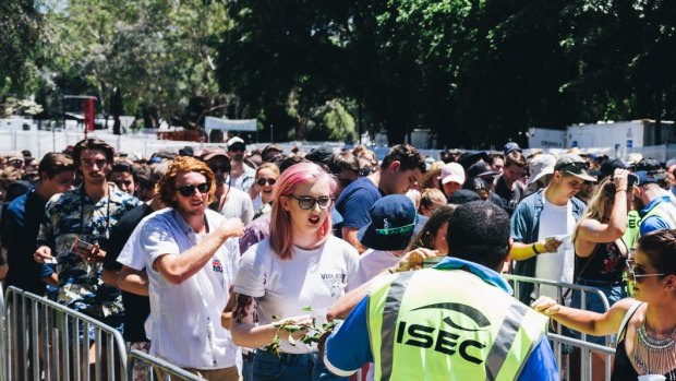 Spilt Milk music festival at Commonwealth Park. Security check IDs at the entry.