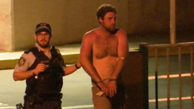 Alleged drink-driver Samuel Davidson is led away by police.