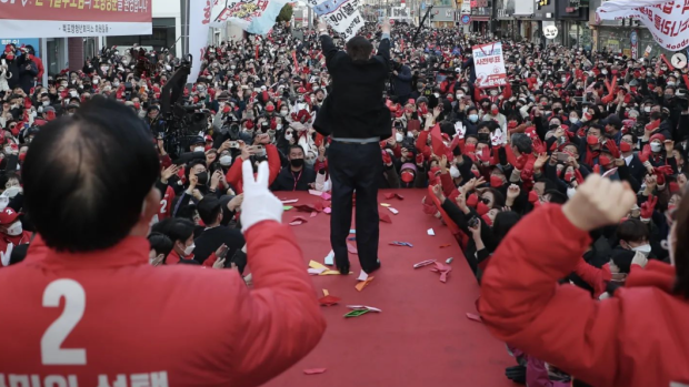 Yoon rallies the crowd in Seoul. 