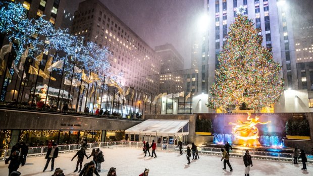 Ice-skating at Rockefeller Center beneath the iconic Christmas tree.