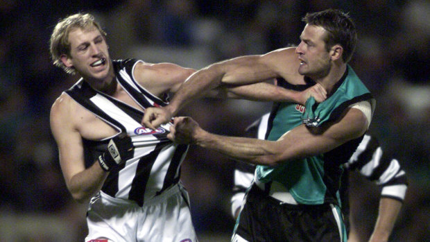 Josh Fraser back in his playing days tussling with Matthew Primus in 2002.