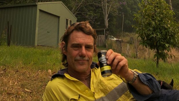 Jim Tait, exhausted after fighting fires on  on his property in northern NSW. 