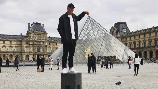 Paris moments: Joseph Manu has fun at the Louvre during the Roosters' downtime in the French capital.