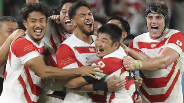 Magic moment: Japan's players celebrate after winning over Ireland.