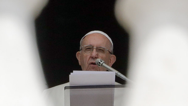 Pope Francis delivers his speech during the Angelus noon prayer he recited from the window of his studio overlooking St Peters Square on Wednesday.