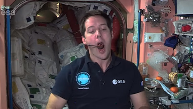 ESA astronaut Thomas Pesquet takes a bite.