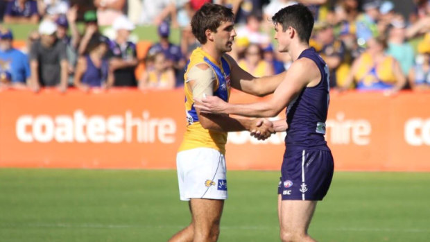 Andrew Gaff and Andrew Brayshaw shakes hands in a 2019 pre-season match ... their first clash since the incident.