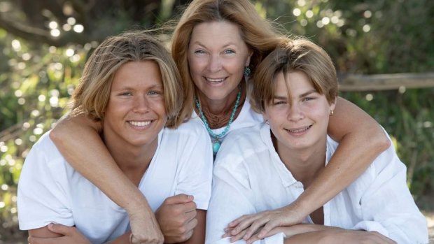 Monika Zwolsman with her sons Yannick, left, and Soren Zwolsman. Ms Zwolsman is angry a photo taken three years ago of her son Soren wearing girl’s bathers at a swim meet was misrepresented to allege bullying in the sport.