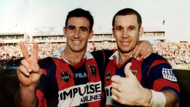 Old firm: Andrew and Matthew Johns celebrate the latter’s final home game in 2000.