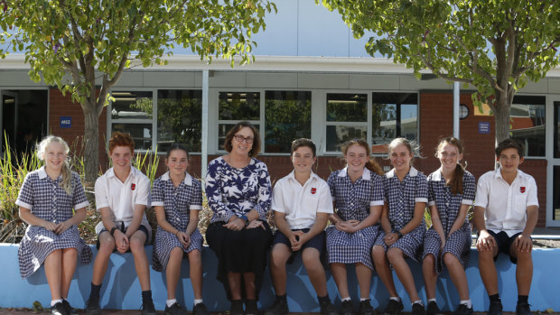 Moama Anglican Grammar principal Carmel Spry with students who attend the border school in NSW.
