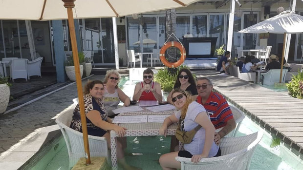 Garry Kirstenfeldt (far right, red and blue shirt) pictured with family.