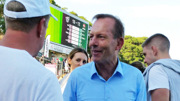 Happy fan: More than 12,000 supporters, including Tony Abbott, saw a gripping encounter.
