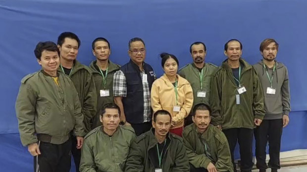 In this photo provided by Thailand’s Foreign Ministry, the first 10 freed Thai hostages and an officer (fourth from left), are pictured at Israel’s Shamir Medical Centre.