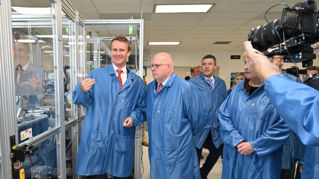 Ellume founder Sean Parsons (left ) hosts Maryland governor Larry Hoganat the company’s facility in April. Six months later, Ellume is up for sale.
