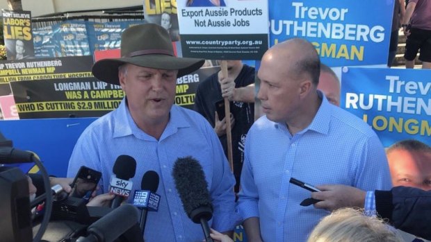 Federal Immigration minister Peter Dutton campaigns with Trevor Ruthenberg in Longman on Super Saturday.