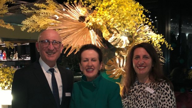 Bernard Pollak and Barbara Pollak celebrate half a century of their Sydney floristry empire with Lord Mayor Clover Moore.