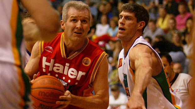Throwback: Mike Kelly, then playing for Townsville, guards Andrew Gaze.