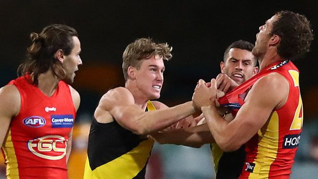 Richmond's Tom Lynch scuffles with Jarrod Witts of the Suns.